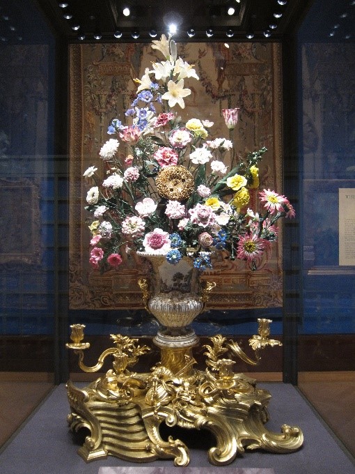 The-restored-porcelain-sunflower-clock-–-Painting-Paradise-Exhibition-Buckingham-Palace