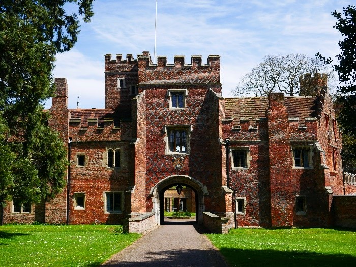 Buckden-the-Inner-Gatehouse-with-bridge-over-moat-ditch-and-arms-of-Bishop-John-Russell-©-Tudor-Times-Ltd